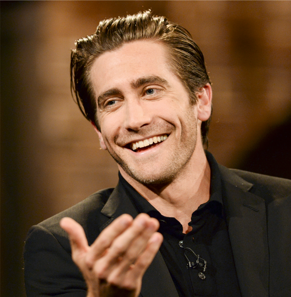 Jake Gyllenhaal laughing merrily during an interview